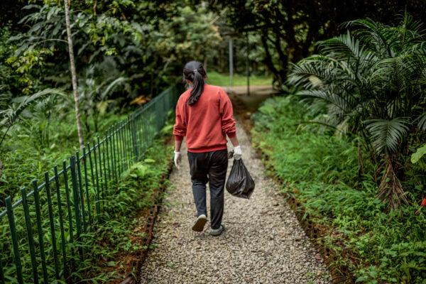 SVW veterinarian, Le Thi Hoai, 25, carries a deceased Chinese pangolin to her laboratory to study the cause of death.