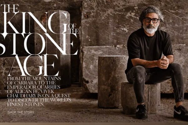 Advertisement hero image: a man in a black shirt sits among large marble stone tables, with bold white text reading 'THE KING OF THE STONE AGE' in the foreground.