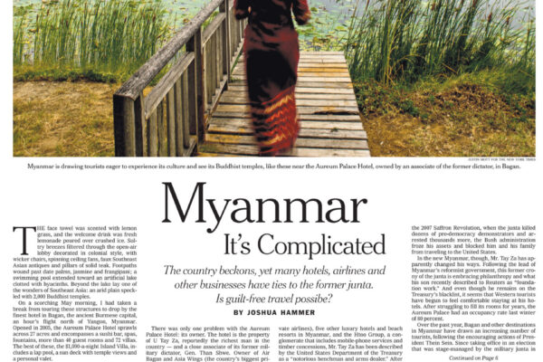 Woman in a maroon dress walks along a wooden dock toward ancient pagodas across a lily-filled lake in Myanmar.