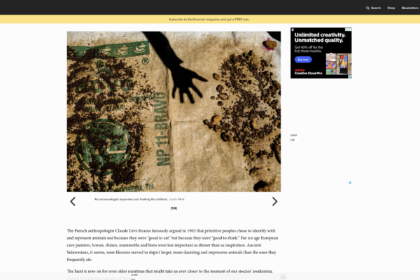 Dusty parchment with dark soil, a black hand silhouette, and green stamp marks, from an archaeology article.